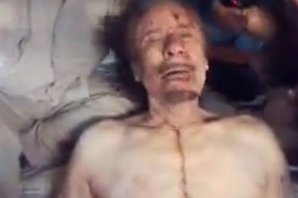 Najšokantniji snimak iživljavanja nad mrtvim Gadafijem