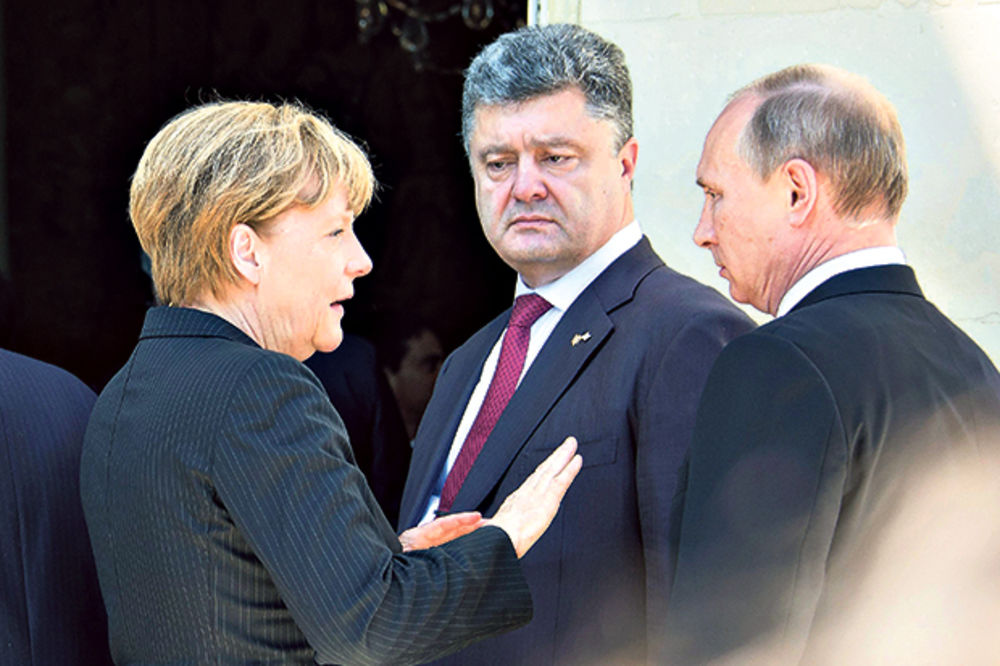 Merkelova pomirila Putina i Porošenka!