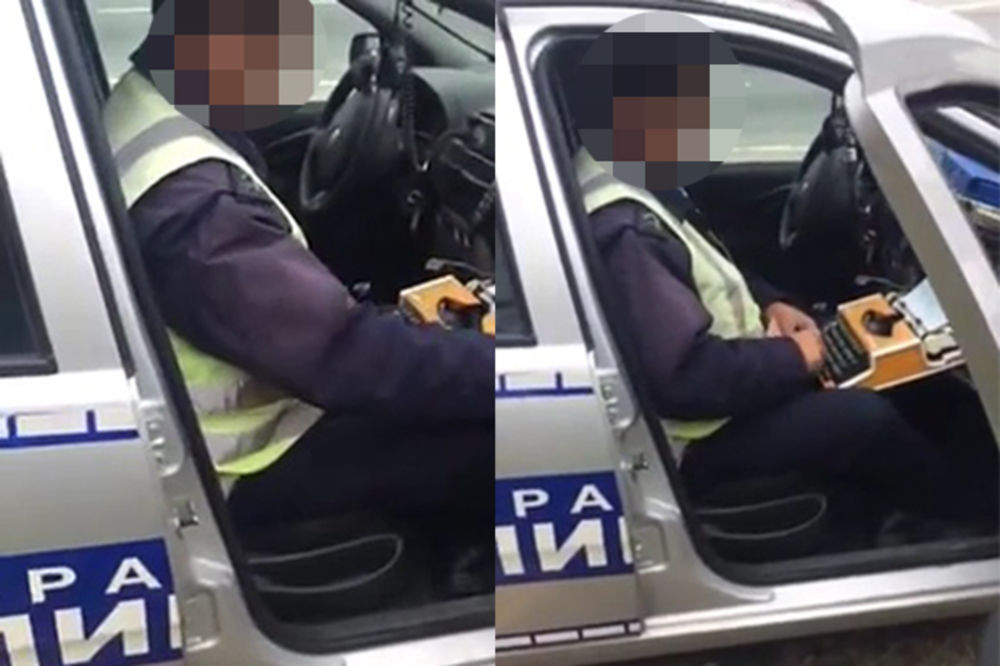 (FOTO) SLIKA NADREALNA, KAZNA REALNA: Policajac stavio pisaću mašinu na kolena i otkucao prijavu!