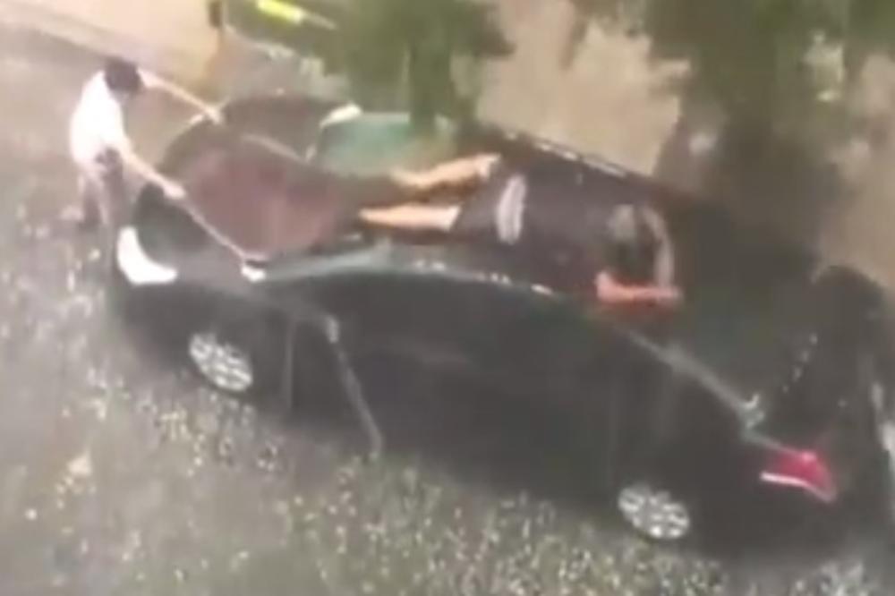 (VIDEO) VAŽNIJA MU KOLA OD GLAVE: Legao na krov automobila, a kad vidite zašto, nećete moći da prestanete da se smejete!