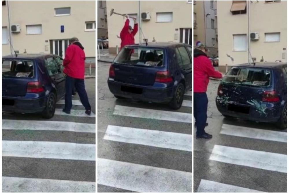 ŠOK NASRED ULICE: Ogromnim čekićem razlupao svoja kola, pa se prijavio policiji! (VIDEO)