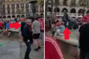 NAVIJAČI LIVERPULA BACILI DEKU U FONTANU: Siroti turista nije znao šta ga je snašlo! Mokrog do gole kože ismevali pijani navijači Redsa! (VIDEO)