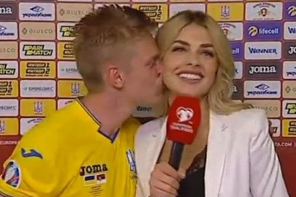 NE KRIJE EMOCIJE: Posle pobede nad Srbijom fudbaler Ukrajine poljubio seksi novinarku, a posle Portugala želeo da je odvede u krevet! (VIDEO)