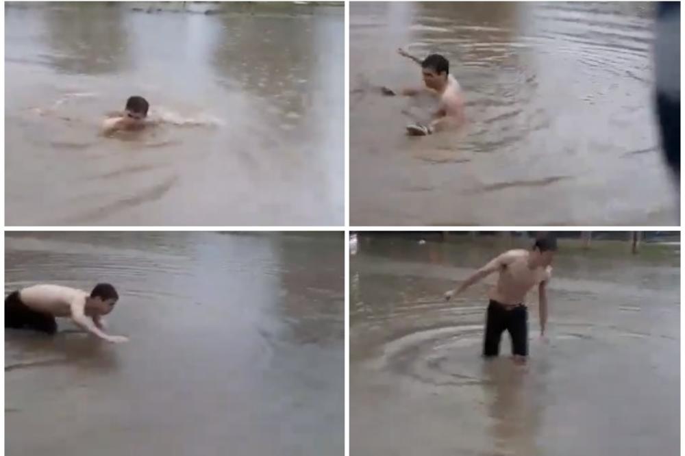 LUDILO U NOVOM BEOGRADU, BIZARNI PRIZORI POPLAVA: Mladić se bacio u vodu u poplavljenoj ulici kod Železničke stanice i zaplivao! (VIDEO)