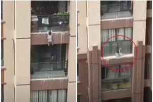 DEČAK (3) PAO SA 6. SPRATA ZGRADE U KINI: Prolaznici uzasnuto gledali kako dete visi sa terase, pa raširili prekrivač kako bi ga uhvatili! (VIDEO)