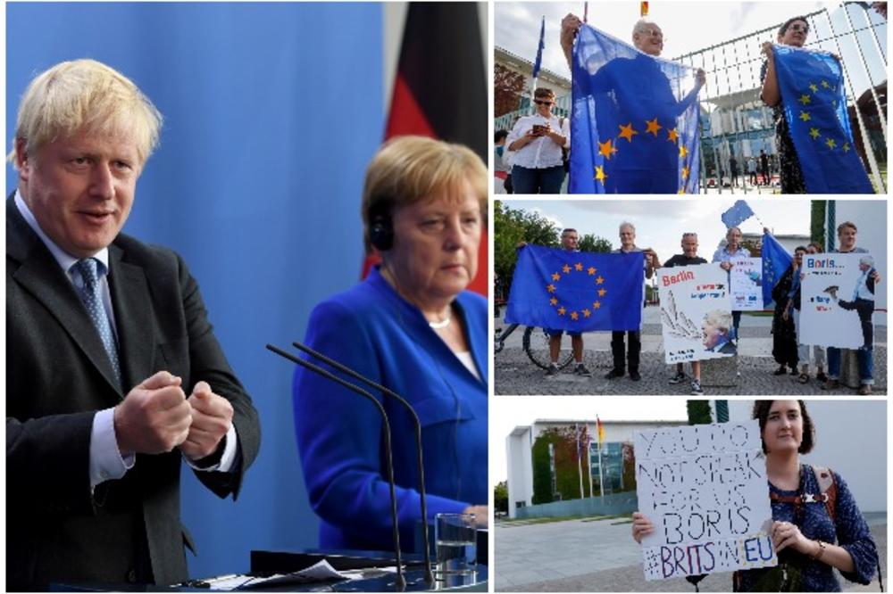 BORIS DŽONSON DOBIO OŠTRU PORUKU U BERLINU: Evo šta su demonstranti poručili britanskom premijeru pre sastanka sa Merkelovom (VIDEO, FOTO)