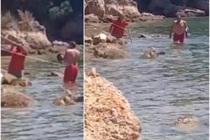 HRVAT PRISVOJIO PLAŽU, PA LOPATOM NAPAO TURISTU: Uhvatio se za polni organ, a kroz megafon psovao kupače (VIDEO)