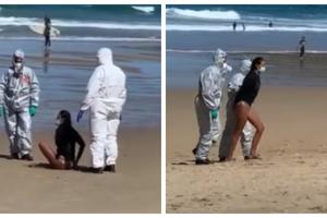 RADI KAO SPASILAC A ŠIRI KORONU: Zaražena devojka uhapšena na silu na plaži jer je rešila da surfuje bolesna! (VIDEO)