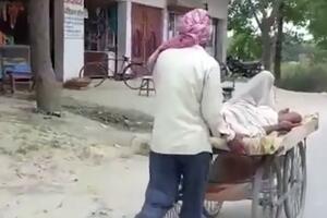 OVAJ SNIMAK ILUSTRUJE SAV HOROR U INDIJI: Evo zašto sin oca transportuje na drvenim kolicima u bolnicu! VIDEO