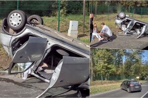 DŽUMBUS NA KOŠUTNJAKU: Auto se prevrnuo na krov! Pored puta sedela uplakana devojka, a kraj nje se momak držao za glavu (FOTO)