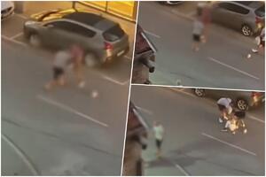 JEZIVO! UZNEMIRUJUĆI SNIMAK NASILJA U NOVOM SADU: Muškarac nokautirao ženu nasred ulice! Dobila pesnicu u glavu (VIDEO)