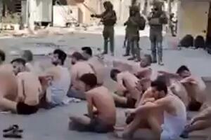 POLUGOLI ZAROBLJENICI SEDE NA ULICI: Izraelska vojska postrojila ljude u donjem vešu i vezanih očiju! (UZNEMIRUJUĆI VIDEO)